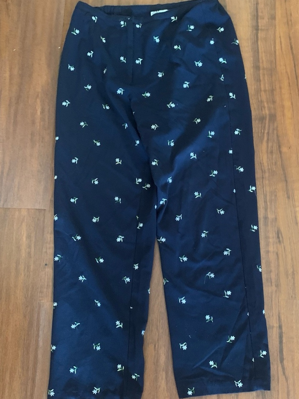 dressbarn Navy pants with Tiny white daisies embroidered all over